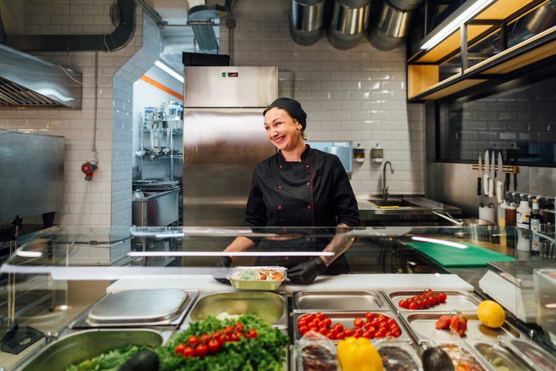 smiling chef at the serving line