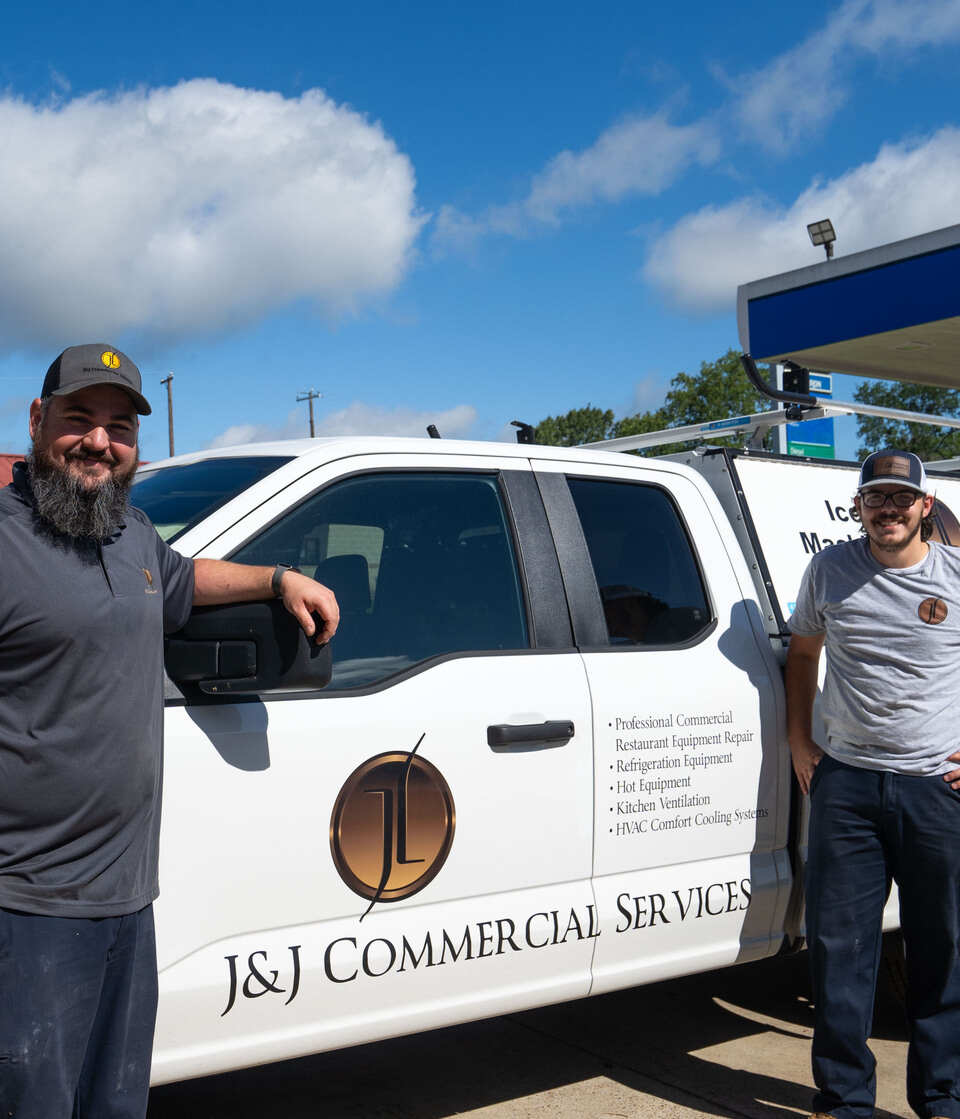 J&J Commercial Services technicians with service truck