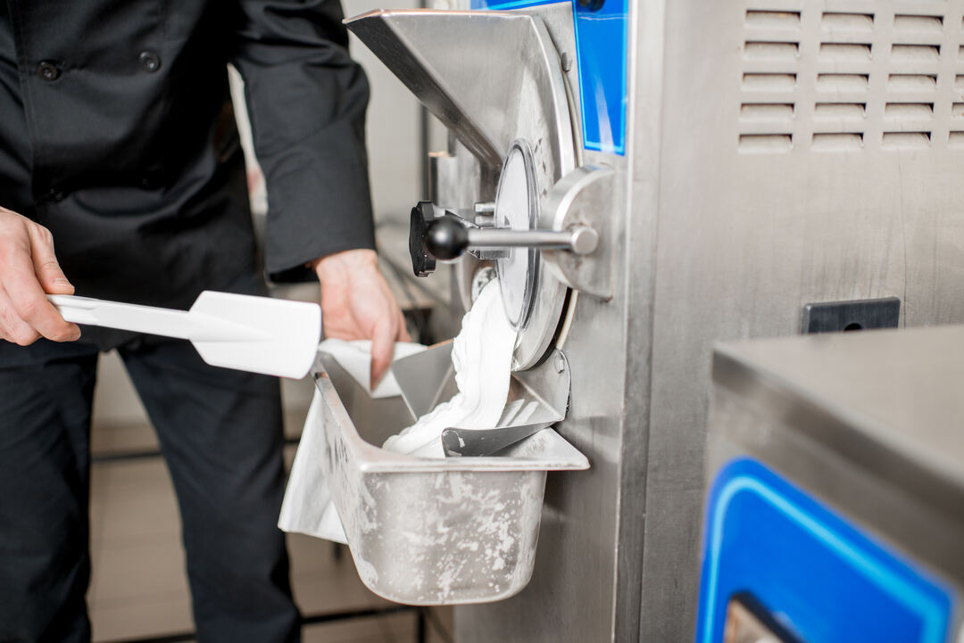 dispensing ice cream into a container