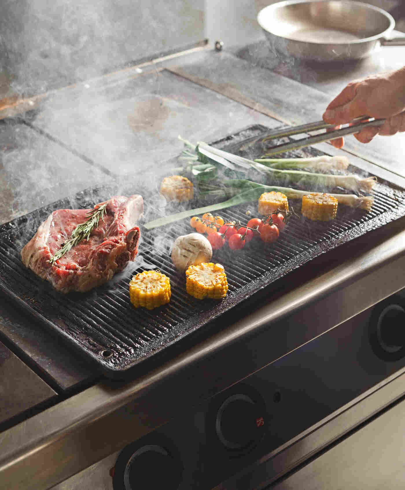 grilling on a commercial flat top griddle