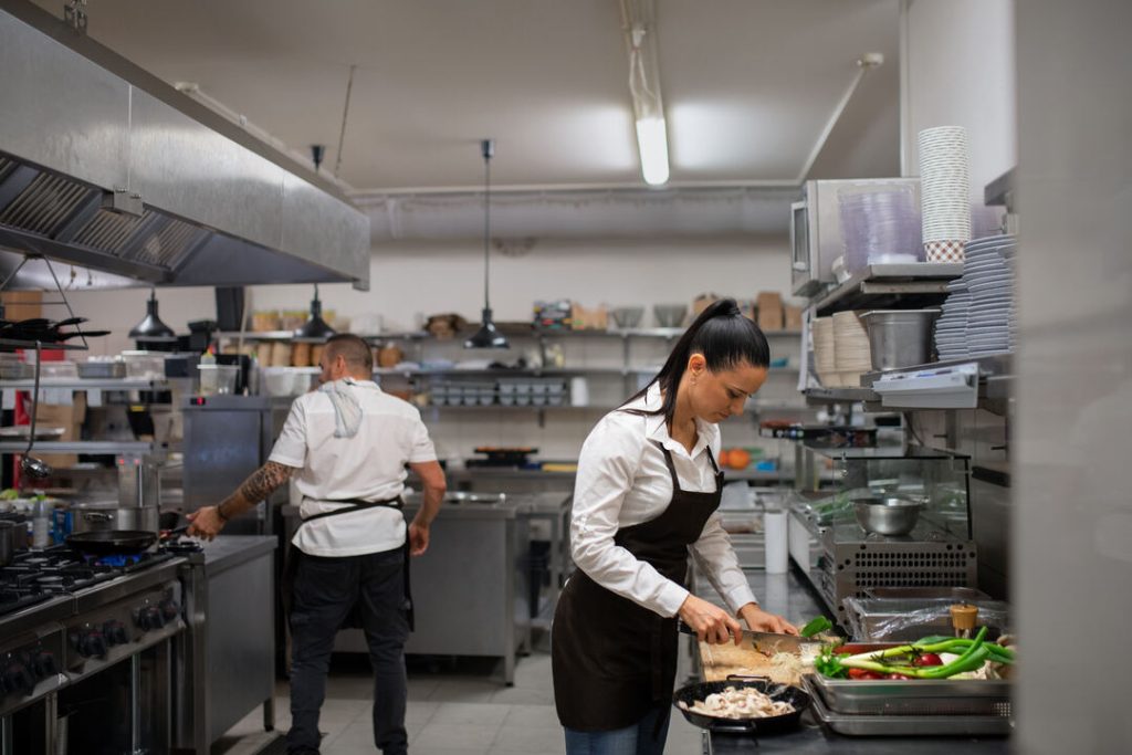 restaurant chef cutting vegetables