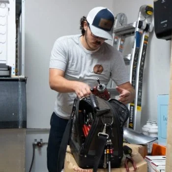 J&J Commercial Services worker in a workshop