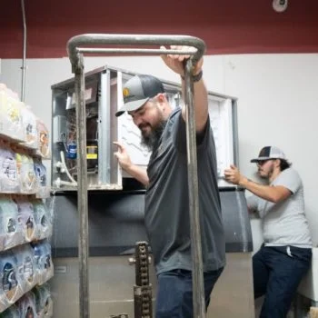 J&J Commercial Services workers in a workshop